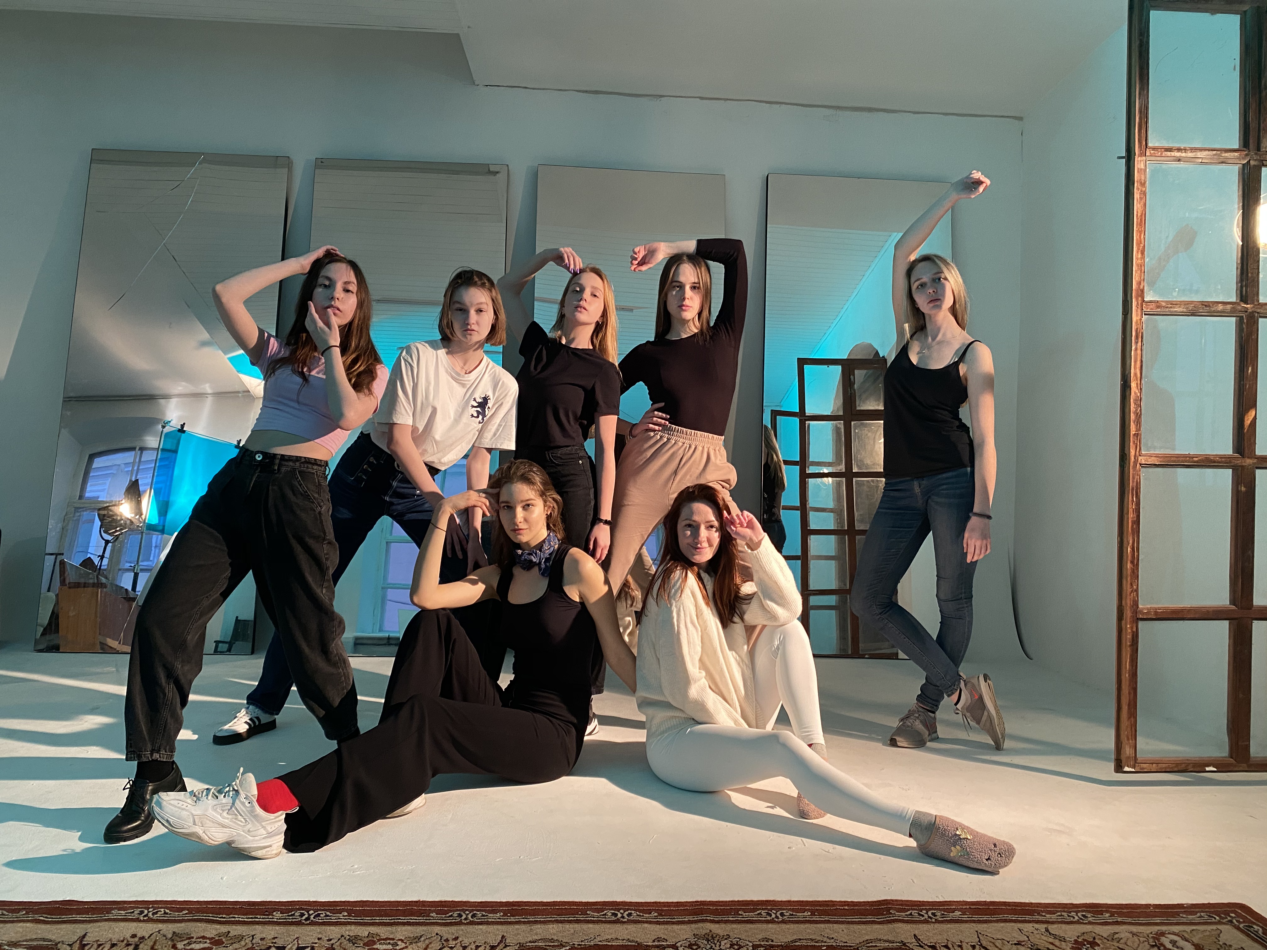 Women exploring movement together in a warm studio
