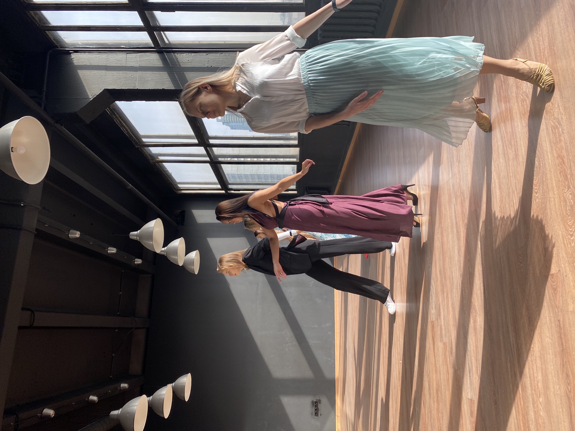 Women discovering new movement possibilities during a posing workshop