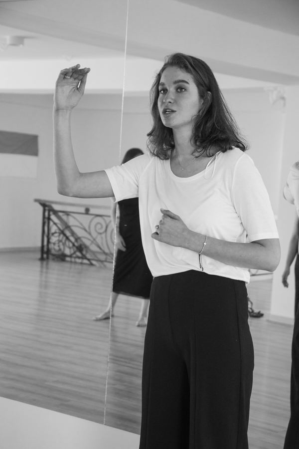 Anasta speaking while facilitating a posing workshop